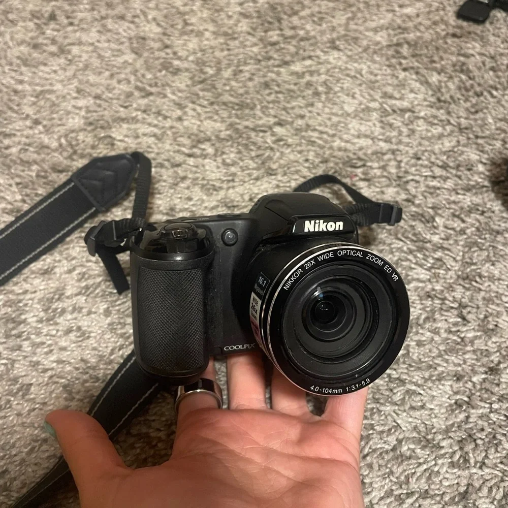 Nikon Black Digital Camera with Strap (DOES NOT TURN ON)